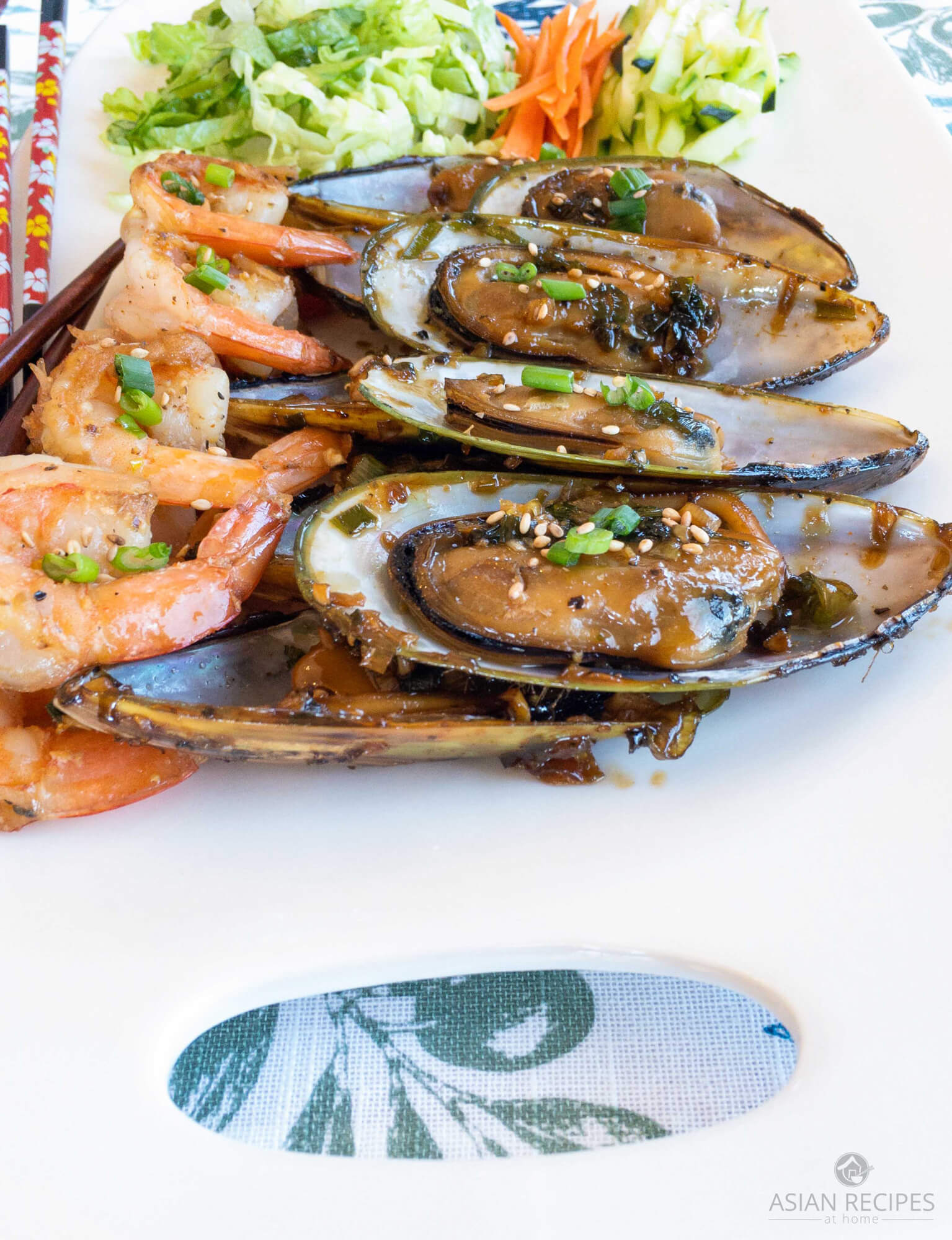 New Zealand Mussels on the half shell and shrimp are cooked in a garlic Asian sauce that is soy-free, gluten-free, Paleo and Whole30 compliant.