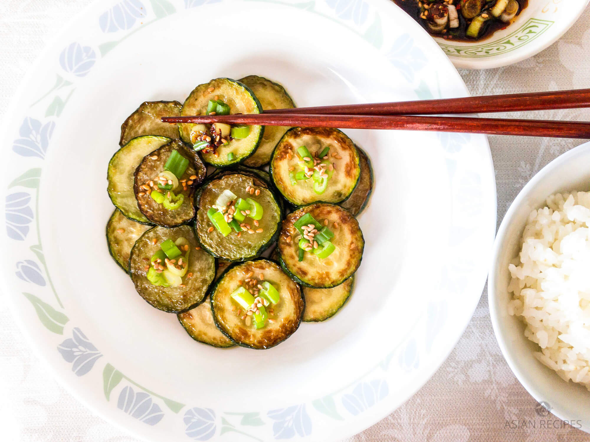 Fresh zucchini is pan-fried with delicious Asian flavors and ingredients. This easy Asian pan-fried zucchini is a healthy recipe that is a great side dish at any time of the year.