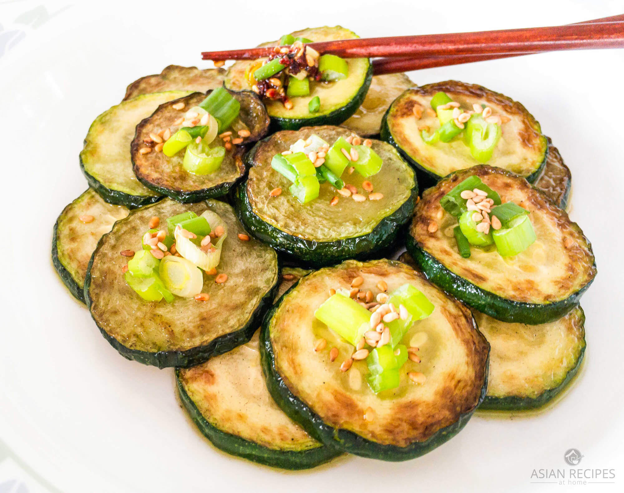 Fresh zucchini is pan-fried with delicious Asian flavors and ingredients. This easy Asian pan-fried zucchini is a healthy recipe that is a great side dish at any time of the year.