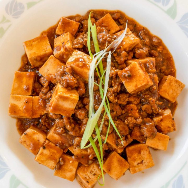 This tofu with spicy meat sauce recipe is our take on mapo tofu. This recipe is hearty and packed with protein and simmered in a spicy sauce.