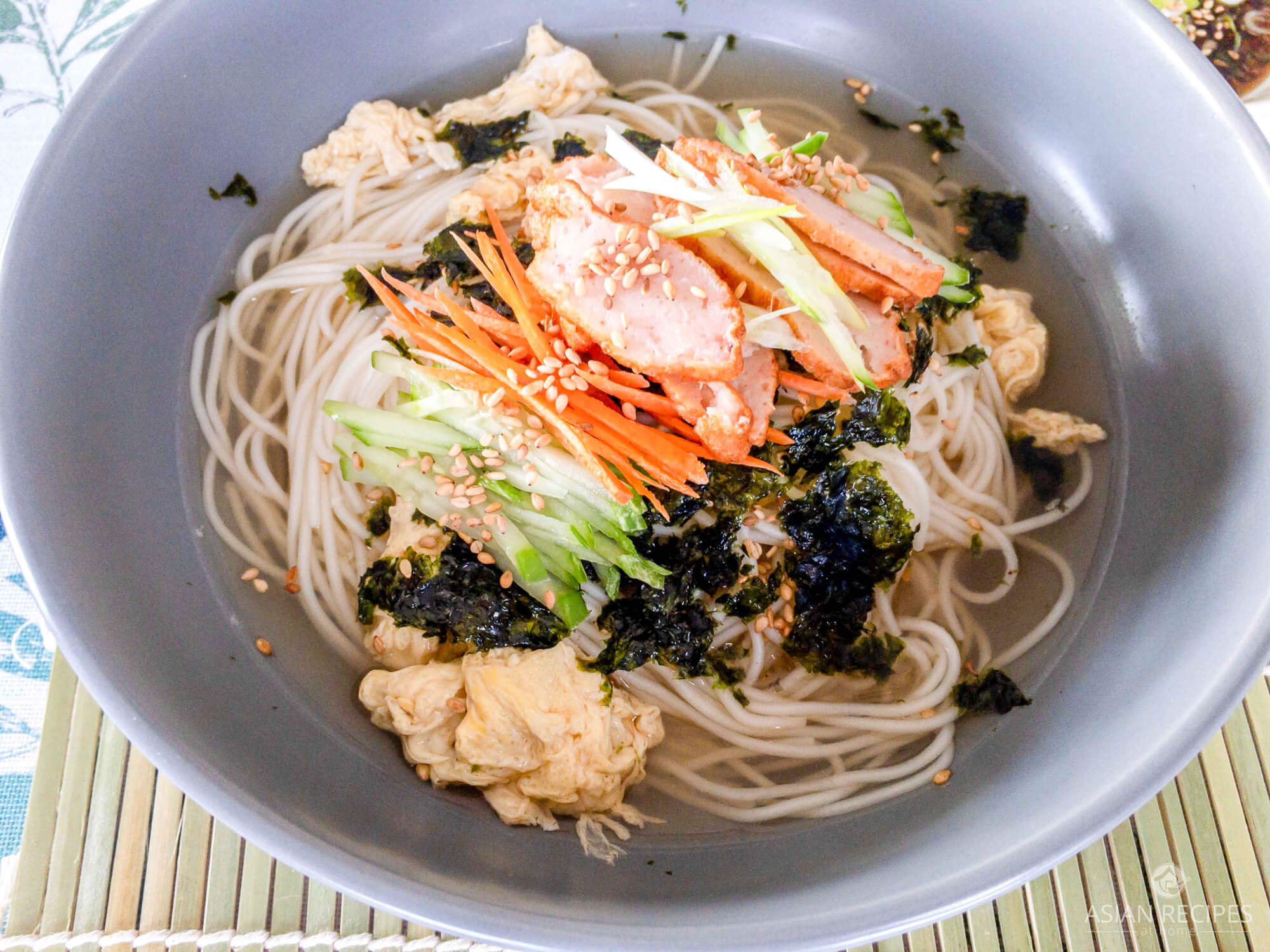 The base of this Korean warm noodle soup recipe is the delicious homemade umami filled clear soup stock. Top this bowl of noodles with vegetables, crumbled roasted nori sheets (gim), and sliced fish cake and you have yourself a fabulous healthy, savory and light meal.