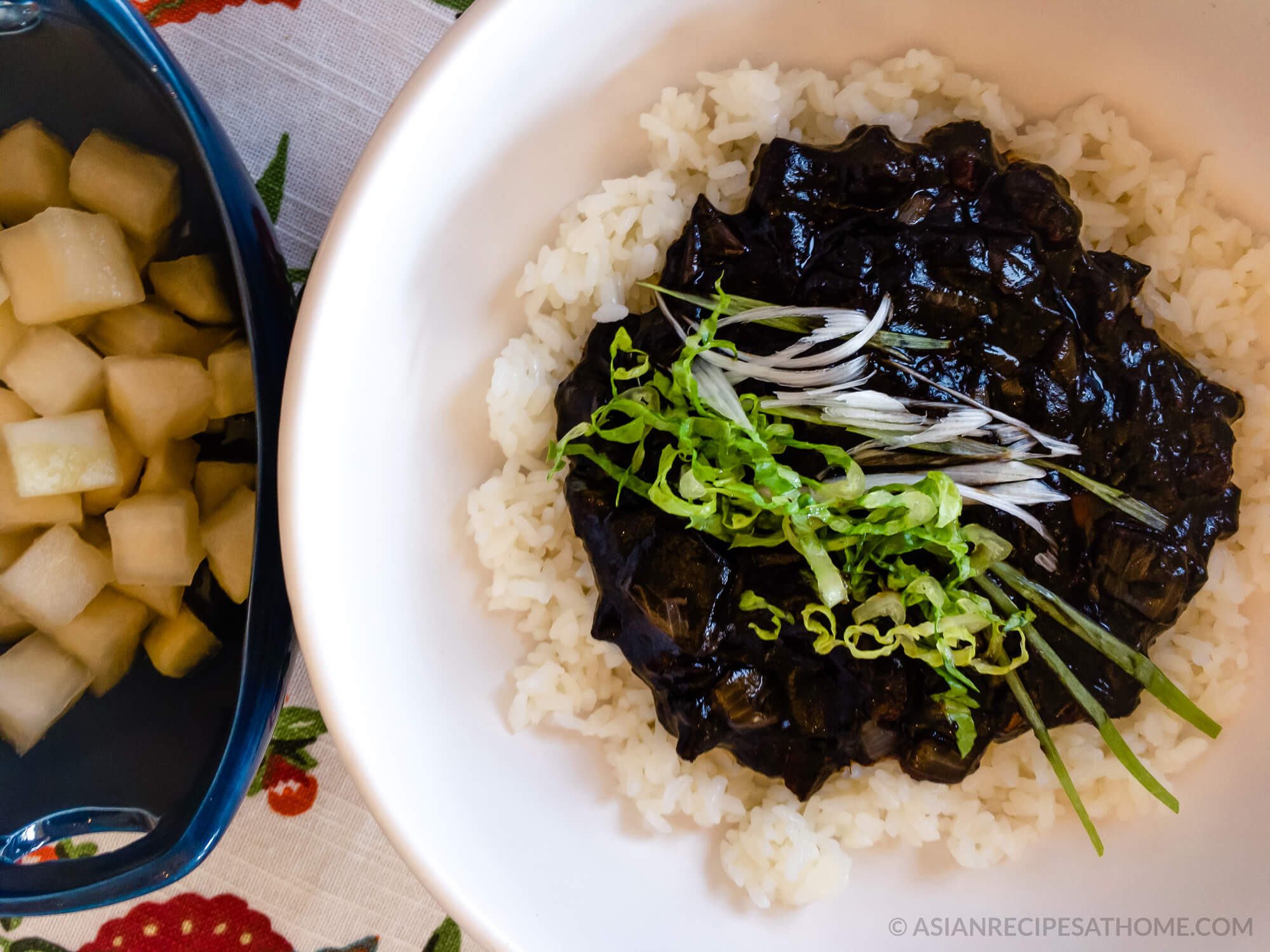 Our Korean-Chinese jjajang rice (jjajangbap 짜장밥) recipe consists of a delicious black bean sauce poured on top of a bed of rice.