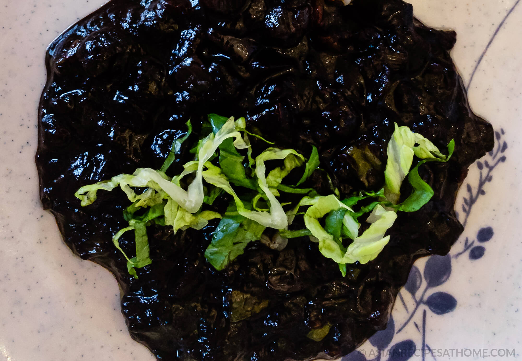 Our Korean-Chinese jjajang rice (jjajangbap 짜장밥) recipe consists of a delicious black bean sauce poured on top of a bed of rice.