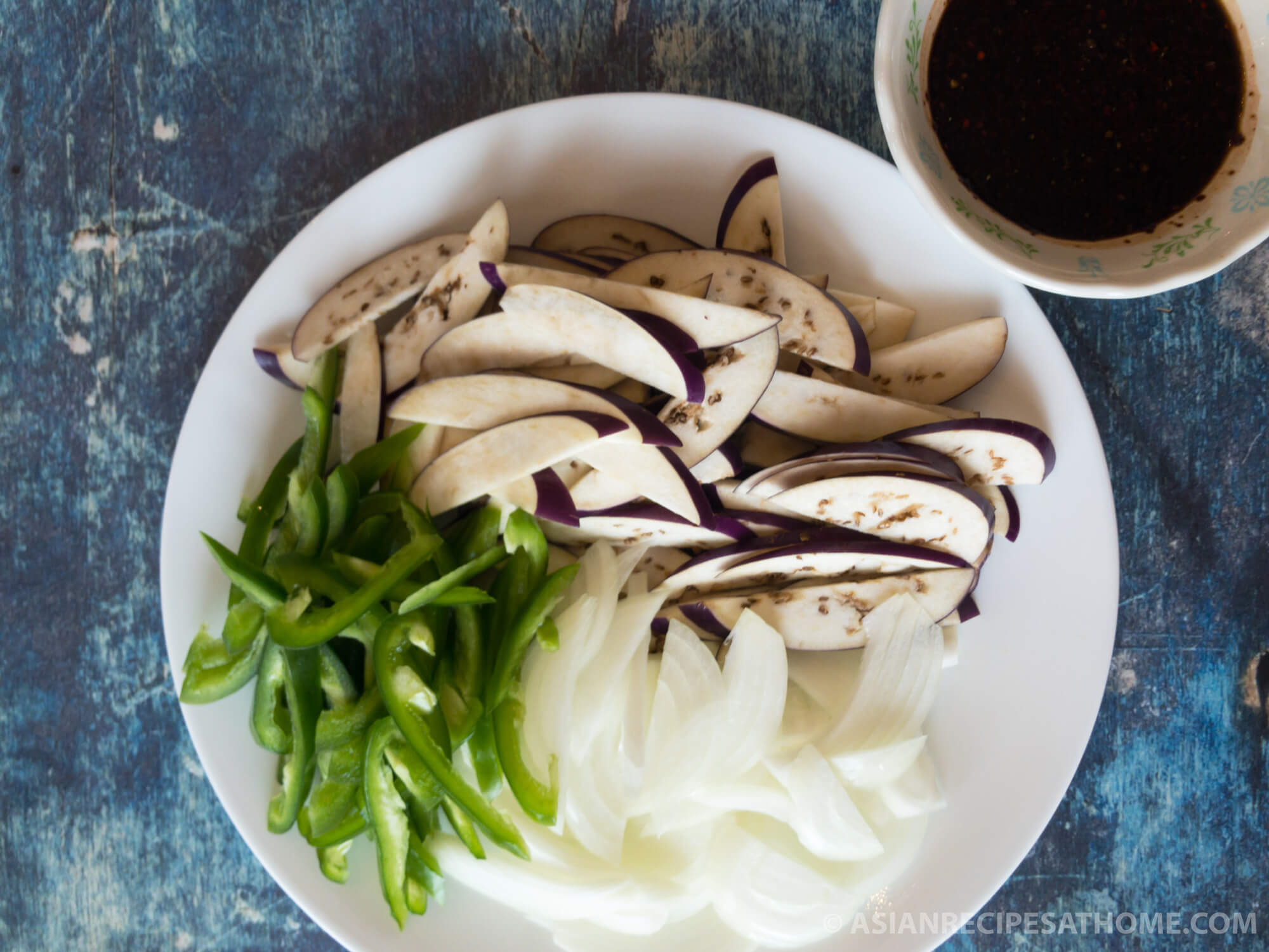 Make our Korean spicy stir-fried eggplant side dish recipe to go with your next meal. This side dish (banchan) is spicy, healthy, and a new spin on how you can prepare eggplants.