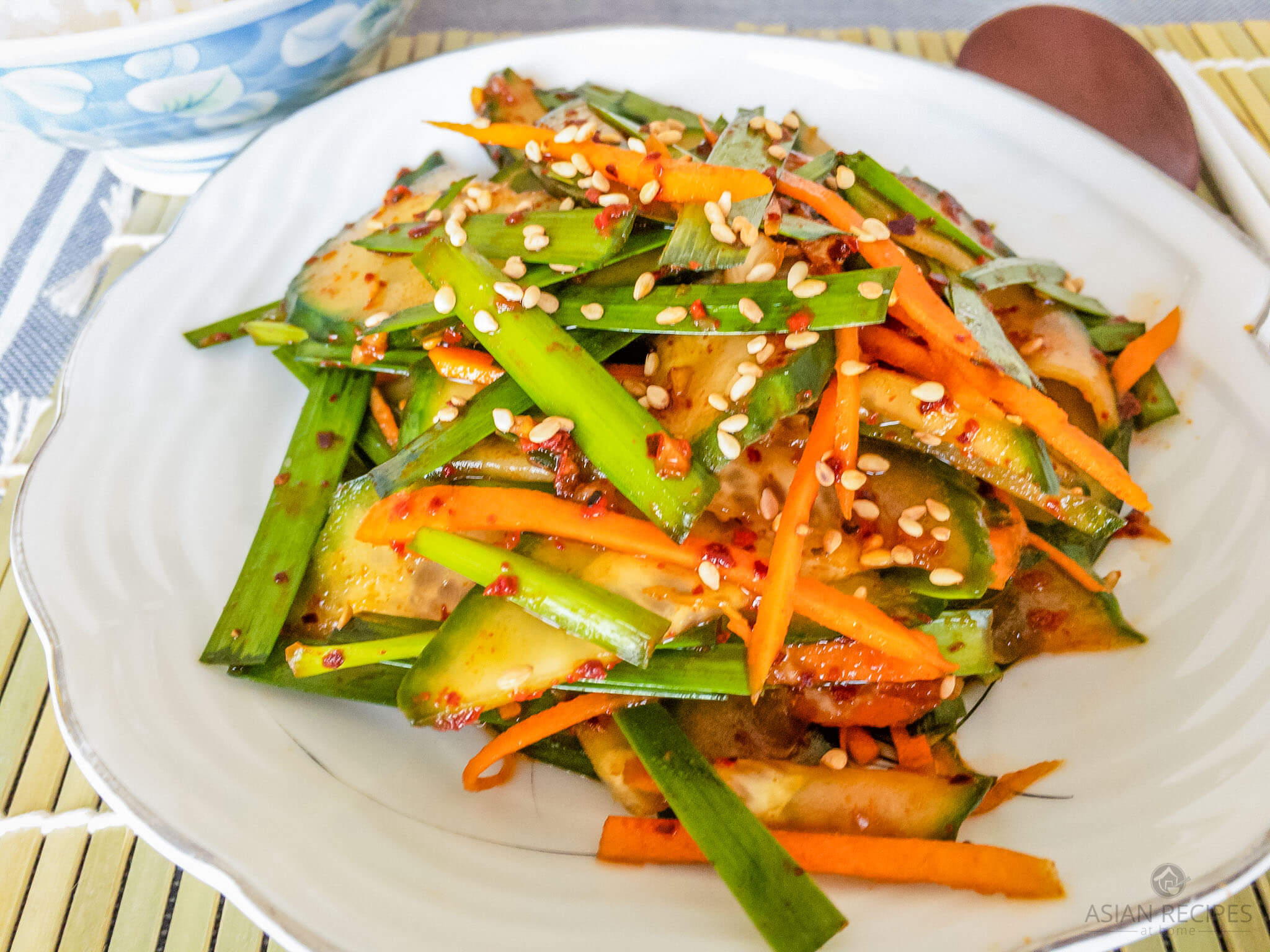 Make this fresh Korean-style cucumber and chive salad with our easy and tasty recipe. Cucumbers and garlic chives are tossed in a red hot chili pepper powder (gochugaru), soy sauce, fish sauce, garlic, and a few other common ingredients. 