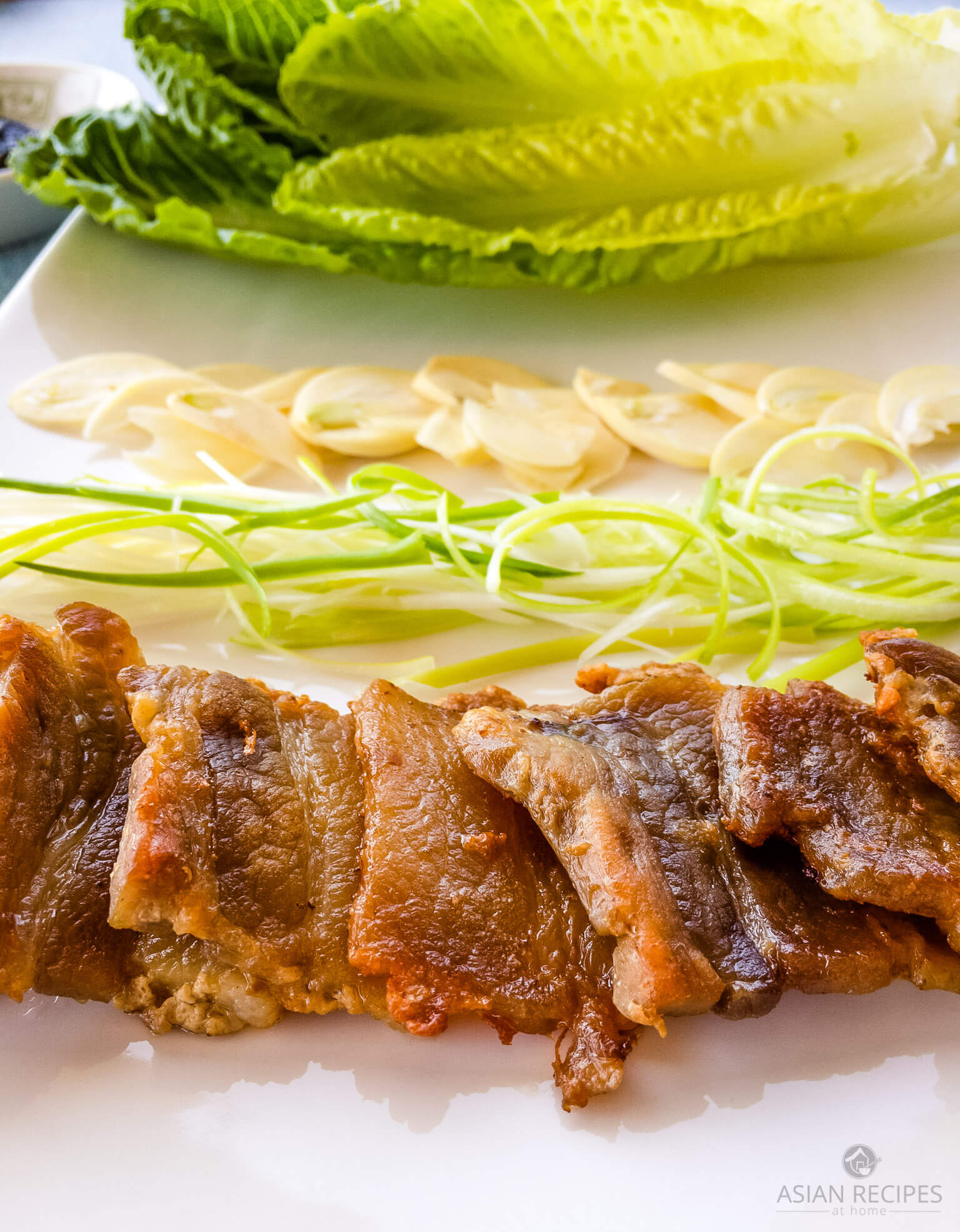 This is one of the more popular Korean BBQ options which consists of pan-fried sliced pork belly, fresh romaine lettuce leaves, sliced garlic, sesame oil, and gochujang.