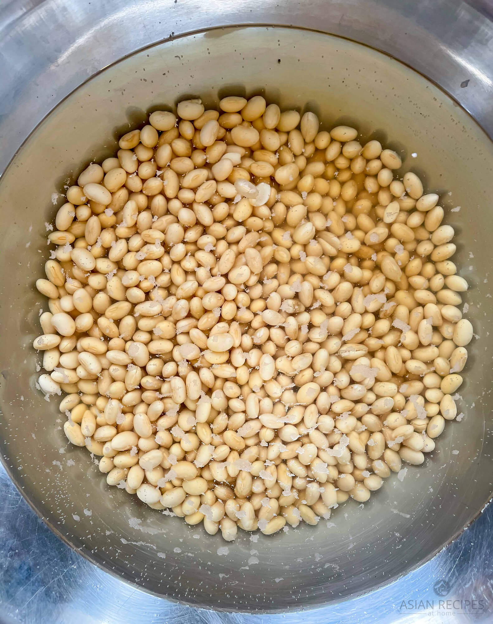Soaking soybeans to make our fermented soybean (natto) recipe.