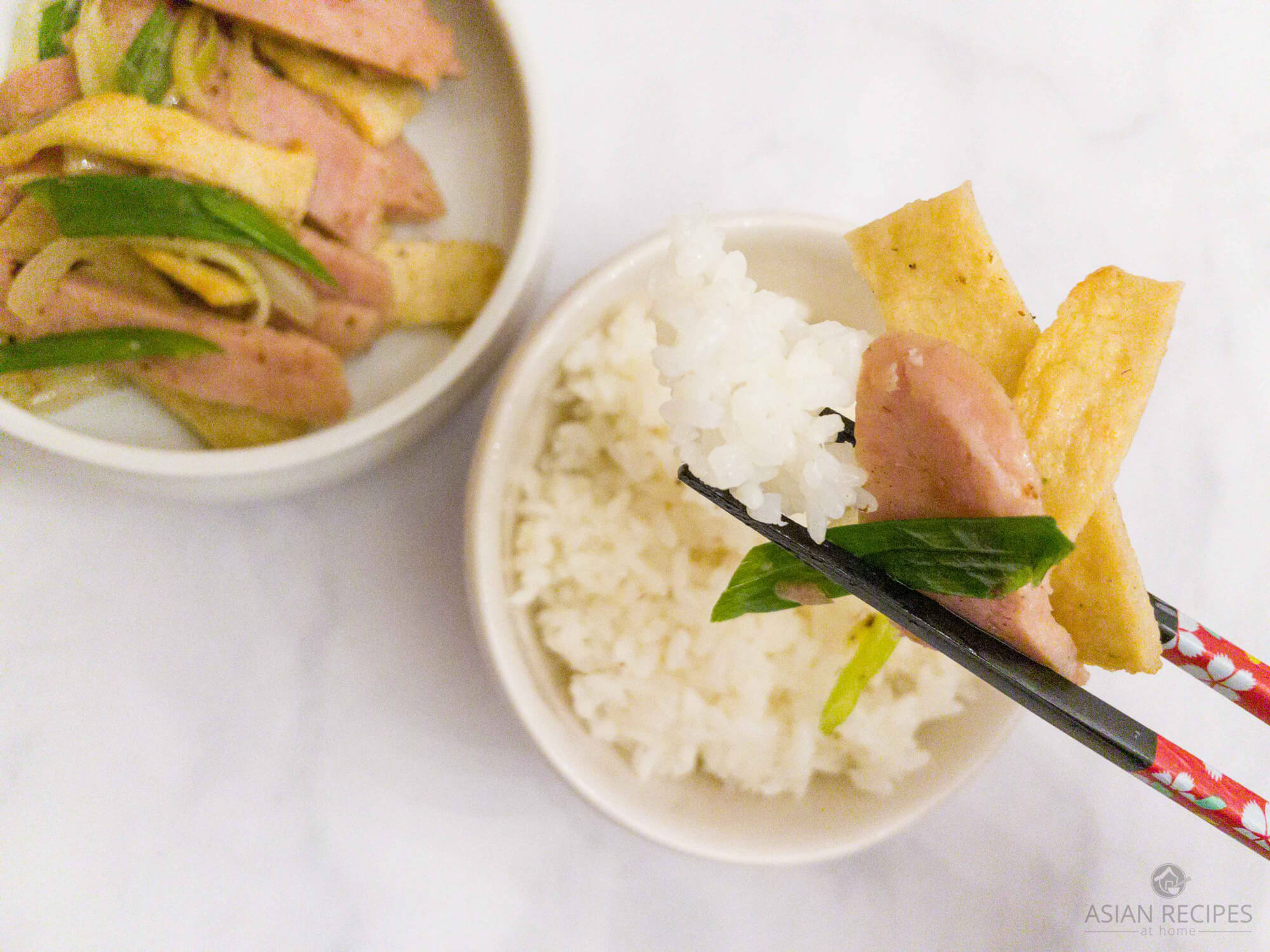This side dish recipe is made with Spam, Korean-style flat fish cakes and onions.