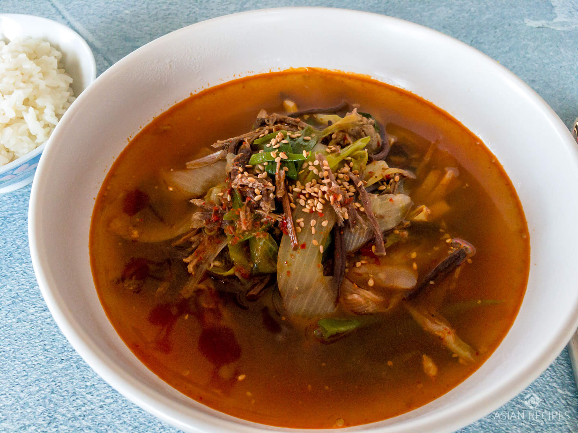 This Korean spicy stew recipe is filled with shredded beef, onions and fernbrake (gosari).