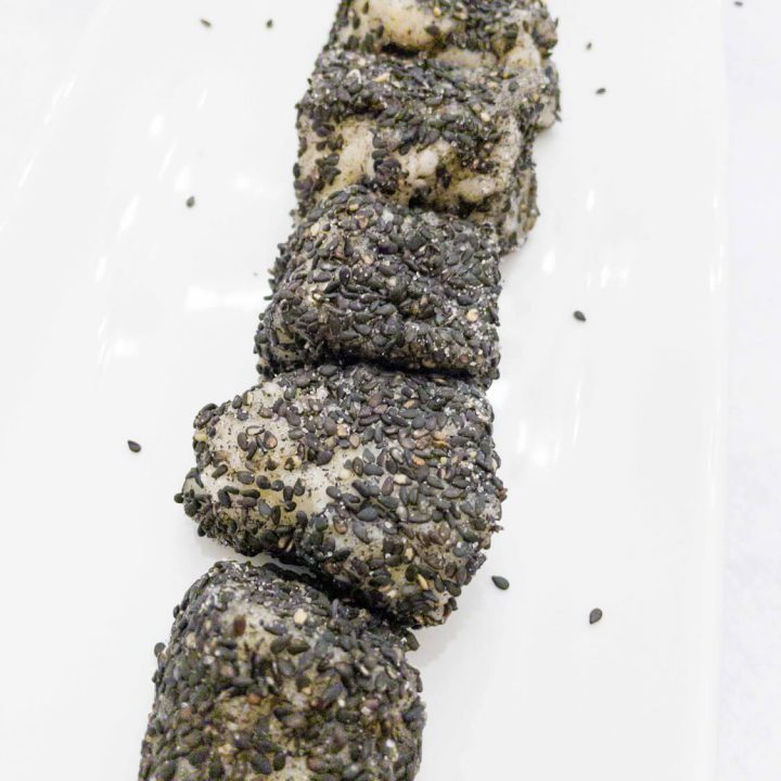 Korean sweet rice cakes are chewy, gooey, and absolutely delicious. Each sweet rice cake is coated on the outside with black sesame seeds which gives it a great nutty flavor profile.