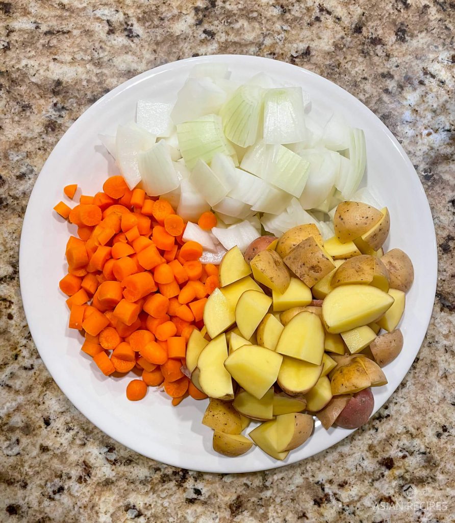 Potatoes, carrots, and onions ready for the Korean curry recipe.