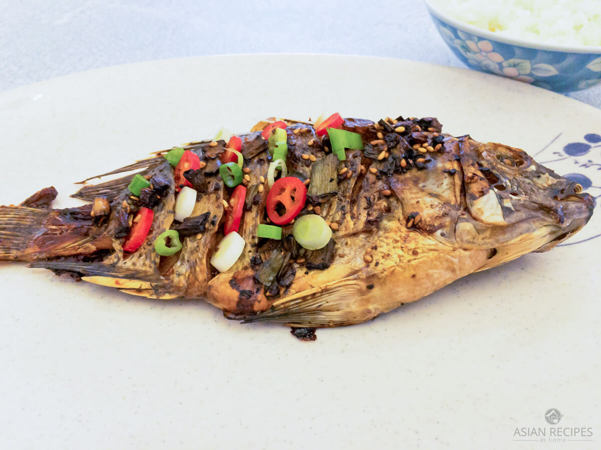 The fish is scored, marinated with a simple combination of salt and pepper prior to roasting in the oven and then later seasoned with an Asian-style sauce.